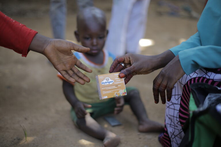 A child receives a nutrition supplement during the ANRiN project in Kano State