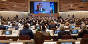 Delegates seated in a large assembly hall during a high-level health meeting
